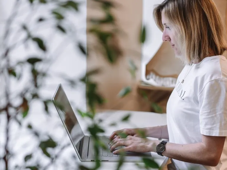 Vera working on a laptop